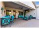 Covered patio with seating area, dining table, and TV at 3332 E Powell Pl, Chandler, AZ 85249