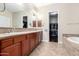 Double vanity bathroom with soaking tub and walk-in shower at 3332 E Powell Pl, Chandler, AZ 85249