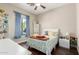 Charming bedroom with a full-size bed and adjacent bookcase at 3332 E Powell Pl, Chandler, AZ 85249