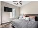 Bright bedroom with a comfortable bed and large window at 3332 E Powell Pl, Chandler, AZ 85249