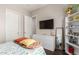 Well-lit bedroom with a full bed and built-in dresser at 3332 E Powell Pl, Chandler, AZ 85249