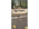 Welcoming Reid's Ranch community entrance with beautiful desert landscaping and a stone accent wall at 3332 E Powell Pl, Chandler, AZ 85249