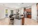 Kitchen boasts an island with seating and granite countertops at 3332 E Powell Pl, Chandler, AZ 85249