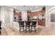 Spacious kitchen with island, stainless steel appliances, and wood cabinets at 3332 E Powell Pl, Chandler, AZ 85249