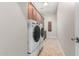 Laundry room with washer, dryer, and extra storage at 3332 E Powell Pl, Chandler, AZ 85249