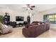 Living room with sectional sofa, hardwood floor, and built-ins at 3332 E Powell Pl, Chandler, AZ 85249