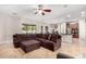 Open living room featuring a large sectional sofa and tile floors at 3332 E Powell Pl, Chandler, AZ 85249