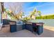 Outdoor kitchen with grill and bar seating at 3332 E Powell Pl, Chandler, AZ 85249