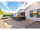 Backyard with pool, outdoor kitchen, and patio at 3332 E Powell Pl, Chandler, AZ 85249