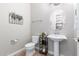 Small powder room with pedestal sink and tile floor at 3332 E Powell Pl, Chandler, AZ 85249