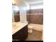 Bathroom features a tub, shower, toilet, and dark brown vanity at 3840 N 43Rd Ave # 75, Phoenix, AZ 85031