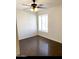 Bright bedroom with dark wood flooring and ceiling fan at 3840 N 43Rd Ave # 75, Phoenix, AZ 85031