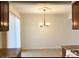 Dining area adjacent to the kitchen with a chandelier at 3840 N 43Rd Ave # 75, Phoenix, AZ 85031