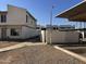 A view of the apartment complex exterior with a sidewalk and covered parking area at 3840 N 43Rd Ave # 75, Phoenix, AZ 85031