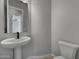 Clean powder room with pedestal sink and toilet at 4275 E Bernice E St, Gilbert, AZ 85295