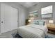 Spacious bedroom with queen bed, window, and stylish decor at 4275 E Bernice E St, Gilbert, AZ 85295