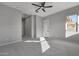 Bright bedroom with ceiling fan and access to hallway at 4275 E Bernice E St, Gilbert, AZ 85295