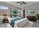 Bedroom with ceiling fan, walk-in closet, and stylish decor at 4275 E Bernice E St, Gilbert, AZ 85295