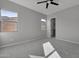 Simple bedroom with ceiling fan and ample natural light at 4275 E Bernice E St, Gilbert, AZ 85295
