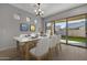 Modern dining room features marble table and backyard access at 4275 E Bernice E St, Gilbert, AZ 85295