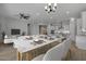 Bright dining area with marble-top table and modern chandelier at 4275 E Bernice E St, Gilbert, AZ 85295