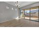 Spacious dining area with sliding glass doors and chandelier at 4275 E Bernice E St, Gilbert, AZ 85295