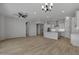 Open concept dining room with chandelier and hardwood floors at 4275 E Bernice E St, Gilbert, AZ 85295