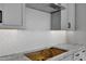 Kitchen backsplash with hexagon tile and granite countertops at 4275 E Bernice E St, Gilbert, AZ 85295