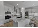Modern kitchen with a large island, stainless steel appliances, and granite countertops at 4275 E Bernice E St, Gilbert, AZ 85295