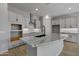 Modern kitchen with light gray cabinets, a large island, and granite countertops at 4275 E Bernice E St, Gilbert, AZ 85295