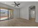 Living area with sliding glass doors to the backyard and neutral decor at 4275 E Bernice E St, Gilbert, AZ 85295