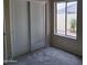 Bedroom with double sliding doors and window at 4841 S Vista Pl, Chandler, AZ 85248
