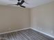 Bedroom with ceiling fan and laminate wood floor at 4841 S Vista Pl, Chandler, AZ 85248