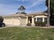 House exterior with three-car garage and lawn at 4841 S Vista Pl, Chandler, AZ 85248
