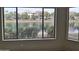 Living room with lake view from large window at 4841 S Vista Pl, Chandler, AZ 85248