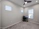 Simple bedroom with a workspace and a ceiling fan at 4871 E Village Dr, Scottsdale, AZ 85254