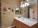 Bright bathroom with double sinks and built-in shelving at 5450 E Mclellan Rd # 215, Mesa, AZ 85205