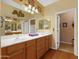 Double vanity bathroom with wood cabinets and a large mirror at 5450 E Mclellan Rd # 215, Mesa, AZ 85205