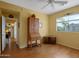 Hardwood floor bedroom with built-in desk and window at 5450 E Mclellan Rd # 215, Mesa, AZ 85205