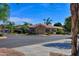 Tan stucco building with tile roof, and landscaping at 5450 E Mclellan Rd # 215, Mesa, AZ 85205
