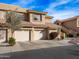 Two-story townhome with two-car garage and desert landscaping at 5450 E Mclellan Rd # 215, Mesa, AZ 85205