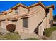 Tan stucco building with tile roof and stairway at 5450 E Mclellan Rd # 215, Mesa, AZ 85205