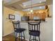 Kitchen with breakfast bar and stainless steel appliances at 5450 E Mclellan Rd # 215, Mesa, AZ 85205