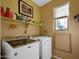 Bright laundry room, washer, dryer, and shelving at 5450 E Mclellan Rd # 215, Mesa, AZ 85205