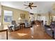 Open living area with hardwood floors, dining area, and access to kitchen at 5450 E Mclellan Rd # 215, Mesa, AZ 85205