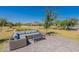 Outdoor seating area with wicker furniture and a coffee table at 6060 S Antonio --, Mesa, AZ 85212