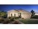 One-story home with light-colored siding, dark shutters, and a stone accent at 6060 S Antonio --, Mesa, AZ 85212