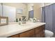 Bathroom with wood vanity, single sink, and shower/tub combo at 6605 N 93Rd Ave # 1087, Glendale, AZ 85305
