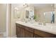 Double vanity bathroom with a large mirror at 6605 N 93Rd Ave # 1087, Glendale, AZ 85305