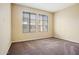 Bright bedroom with neutral carpeting and large windows at 6605 N 93Rd Ave # 1087, Glendale, AZ 85305